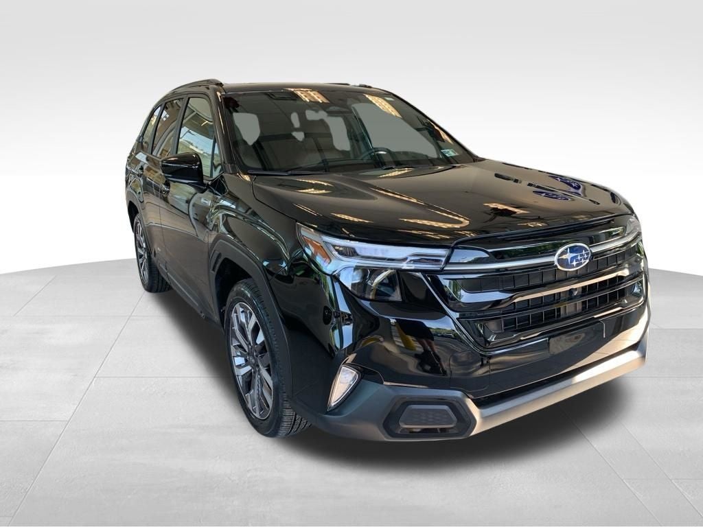 2026 Subaru FORESTER Touring Hybrid in Crystal Black Silica — front three-quarter view
