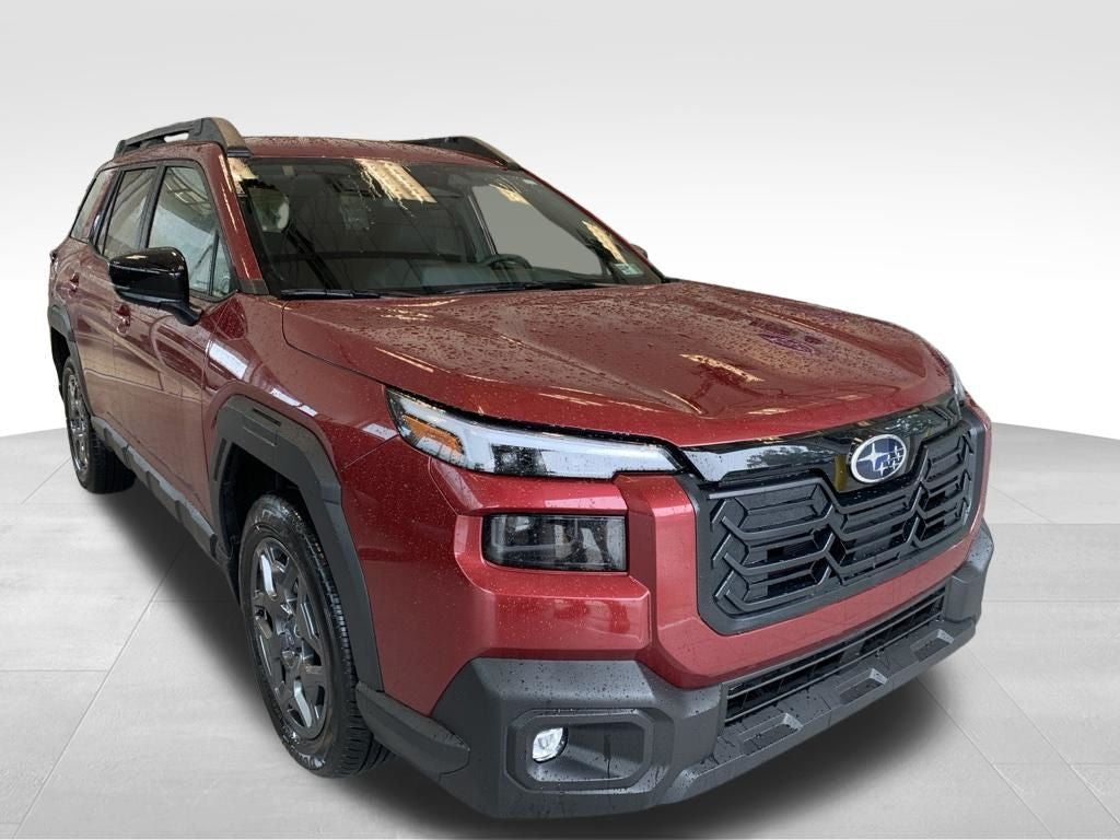 2026 Subaru OUTBACK Premium in Crimson Red Pearl — front three-quarter view
