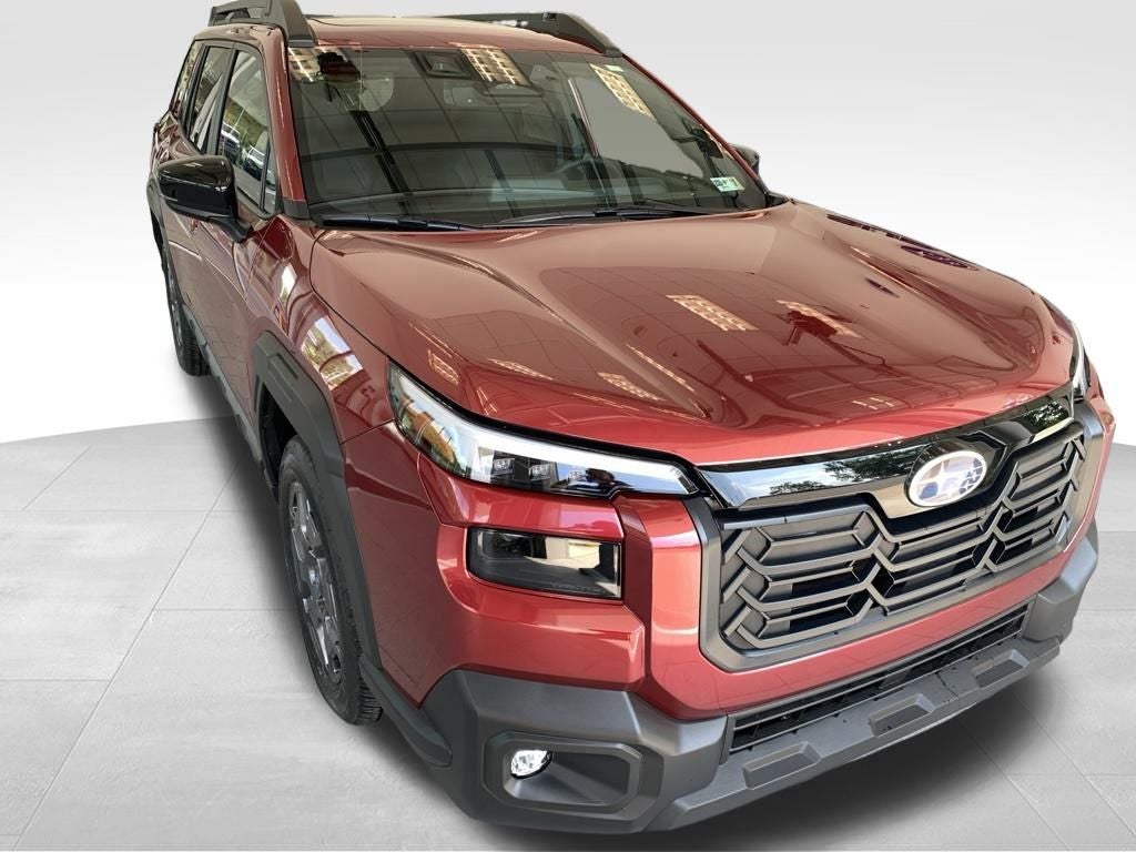 2026 Subaru OUTBACK Premium in Crimson Red Pearl — front three-quarter view
