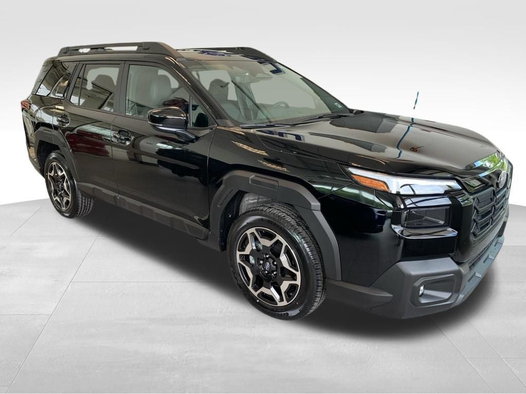 2026 Subaru OUTBACK Touring in Crystal Black Silica — front three-quarter view