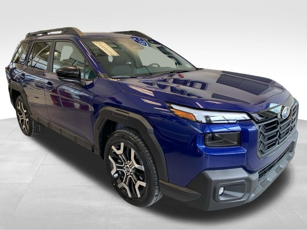 2026 Subaru OUTBACK Touring XT in Sapphire Blue Pearl — front three-quarter view