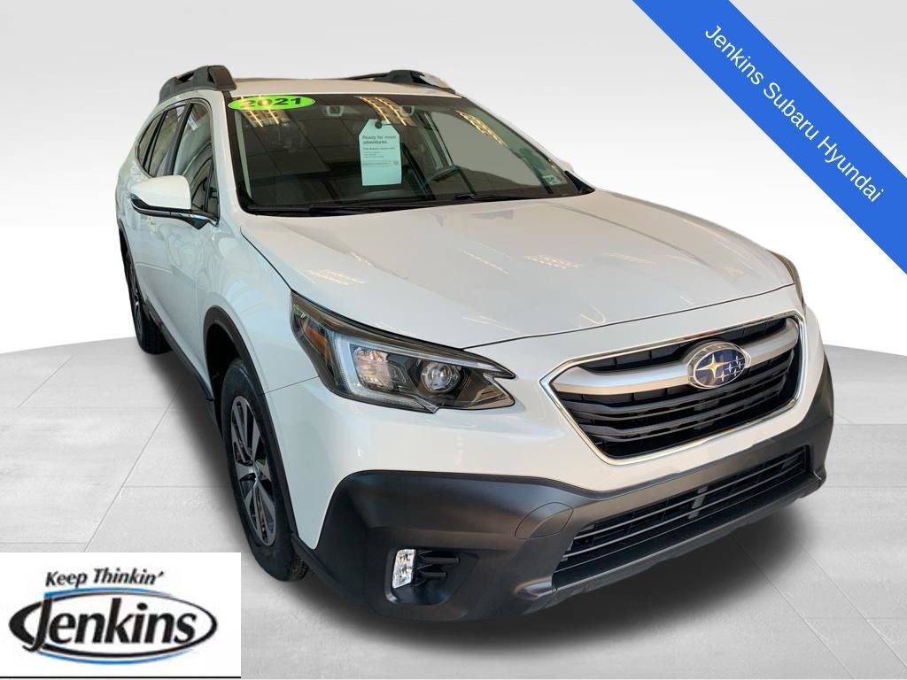 2021 Subaru Outback Premium in Crystal White Pearl — front three-quarter view