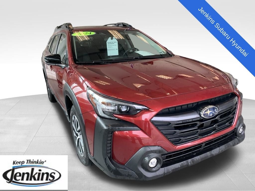 2024 Subaru Outback Premium in Crimson Red Pearl — front three-quarter view