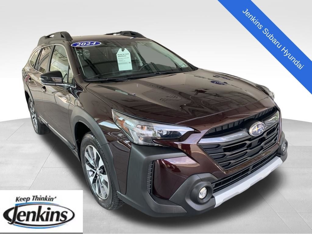 2024 Subaru Outback Limited in Dark Mahogany Pearl — front three-quarter view