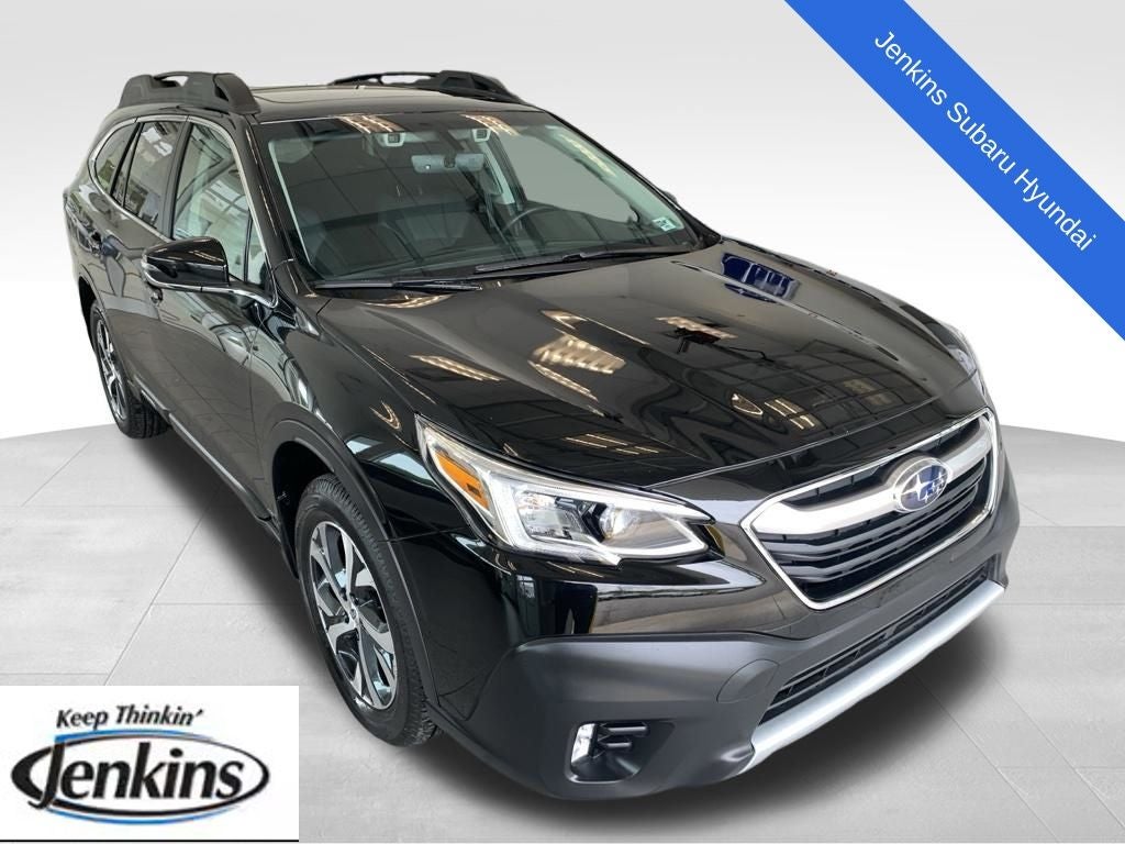 2021 Subaru Outback Limited in Crystal Black Silica — front three-quarter view