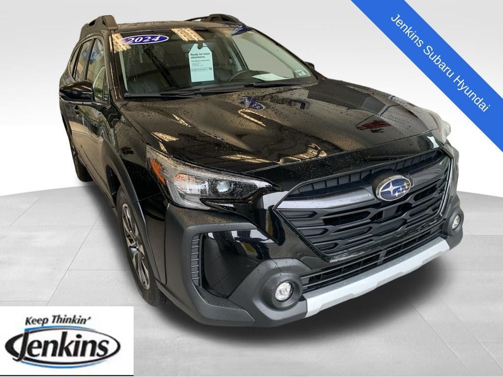 2024 Subaru Outback Limited in Crystal Black Silica — front three-quarter view