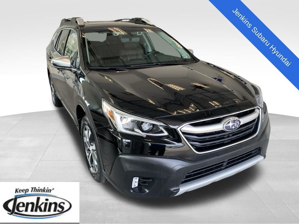 2021 Subaru Outback Touring XT in Crystal Black Silica — front three-quarter view