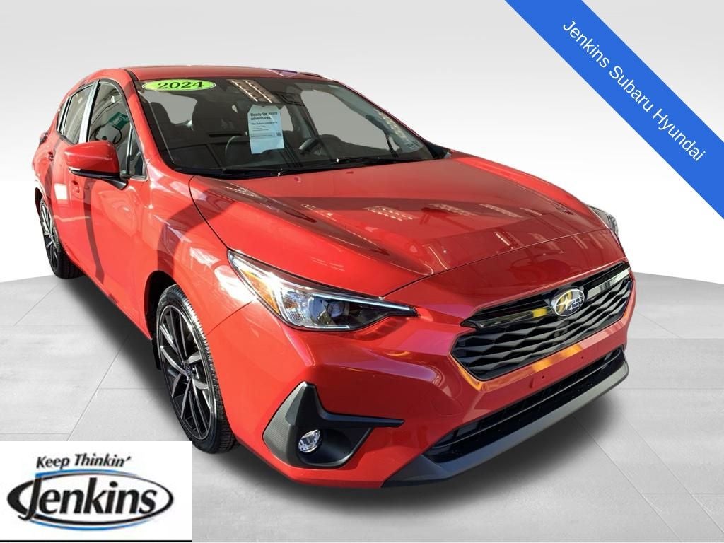 2024 Subaru Impreza Sport in Pure Red — front three-quarter view