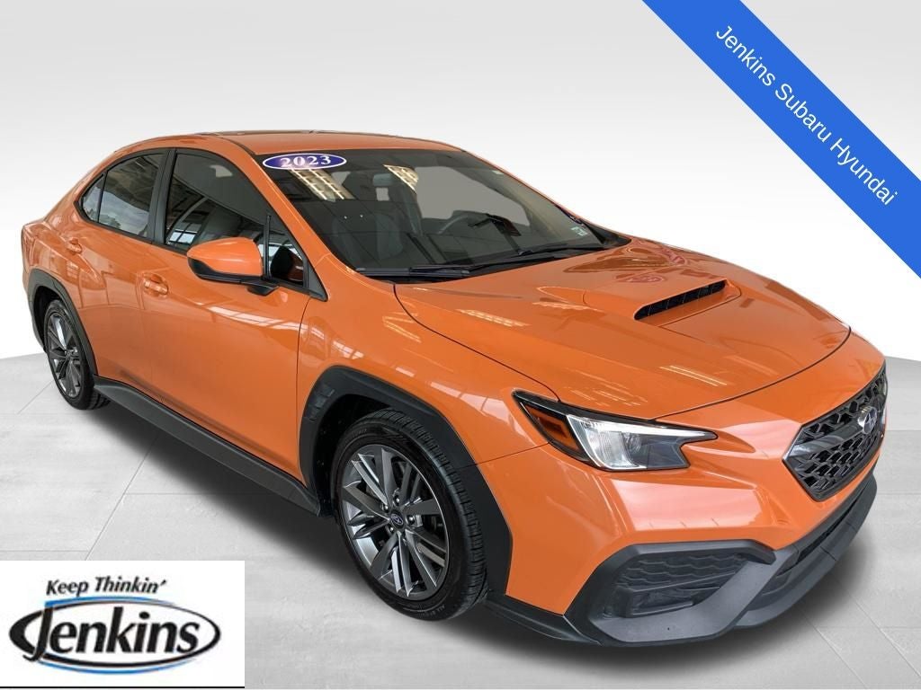 2023 Subaru WRX Base in Solar Orange Pearl — front three-quarter view